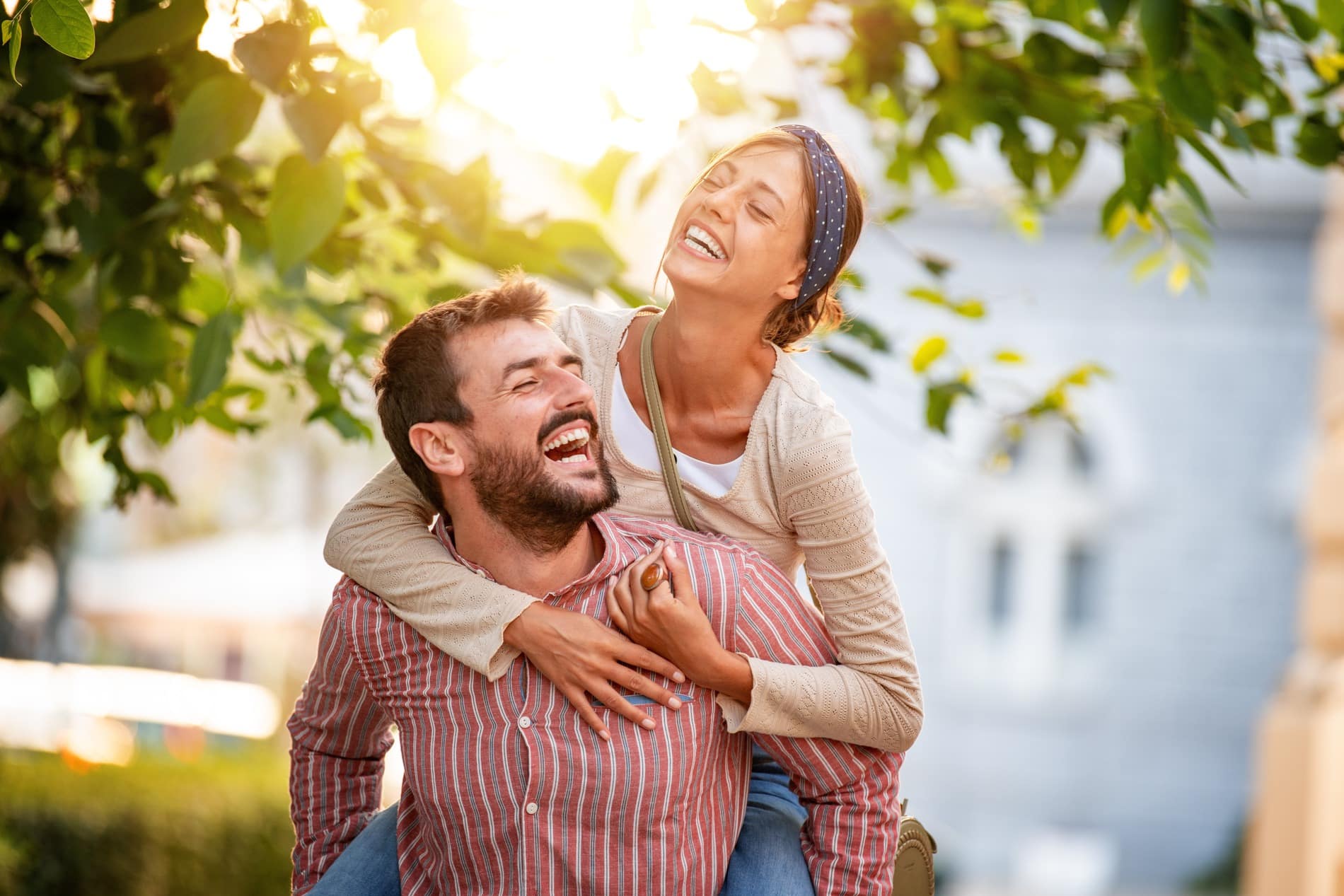Couple with bright smiles after getting a composite tooth-colored filling in Chesterfield MI